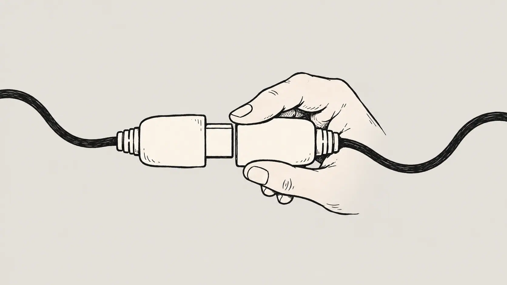 A hand joining two cable connectors